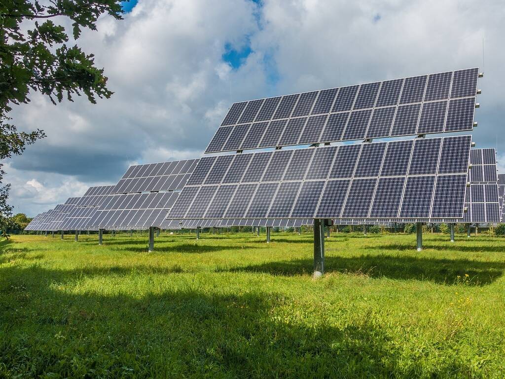 A stock picture of solar panels on a field