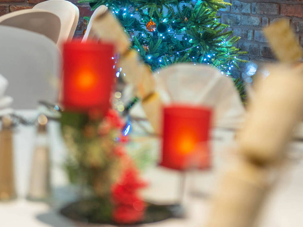 The Moat Suite decorated for Christmas  with Christmas crackers and a light up Christmas tree