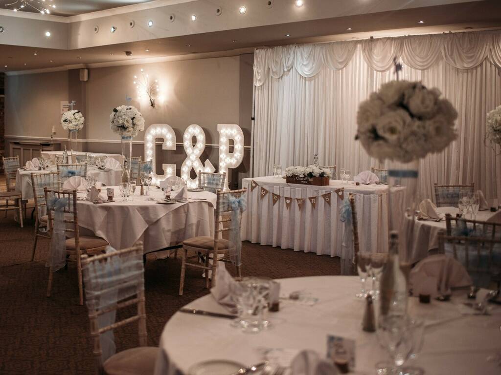 Moat Suite set up for wedding with G&P light up decorations and table centrepieces