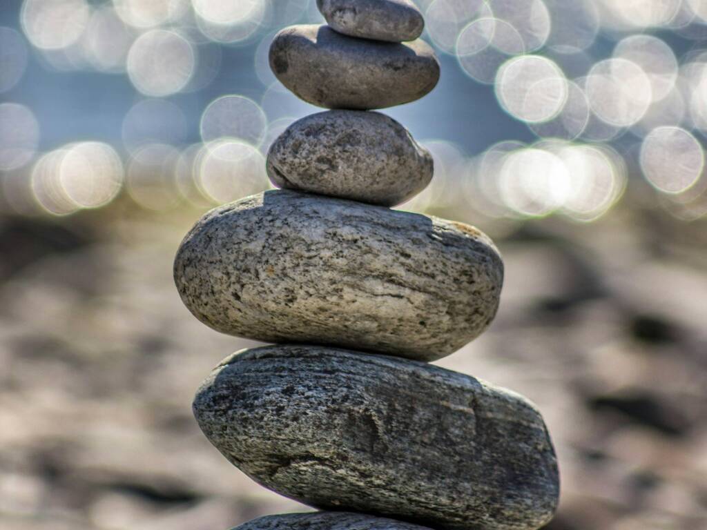 A pictures of a pile of rocks by the sea