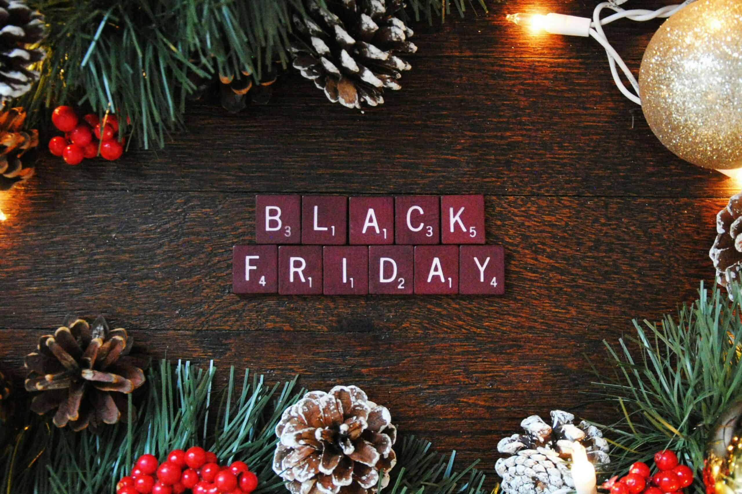 Black Friday scrabble letters surrounded with Christmas decorations